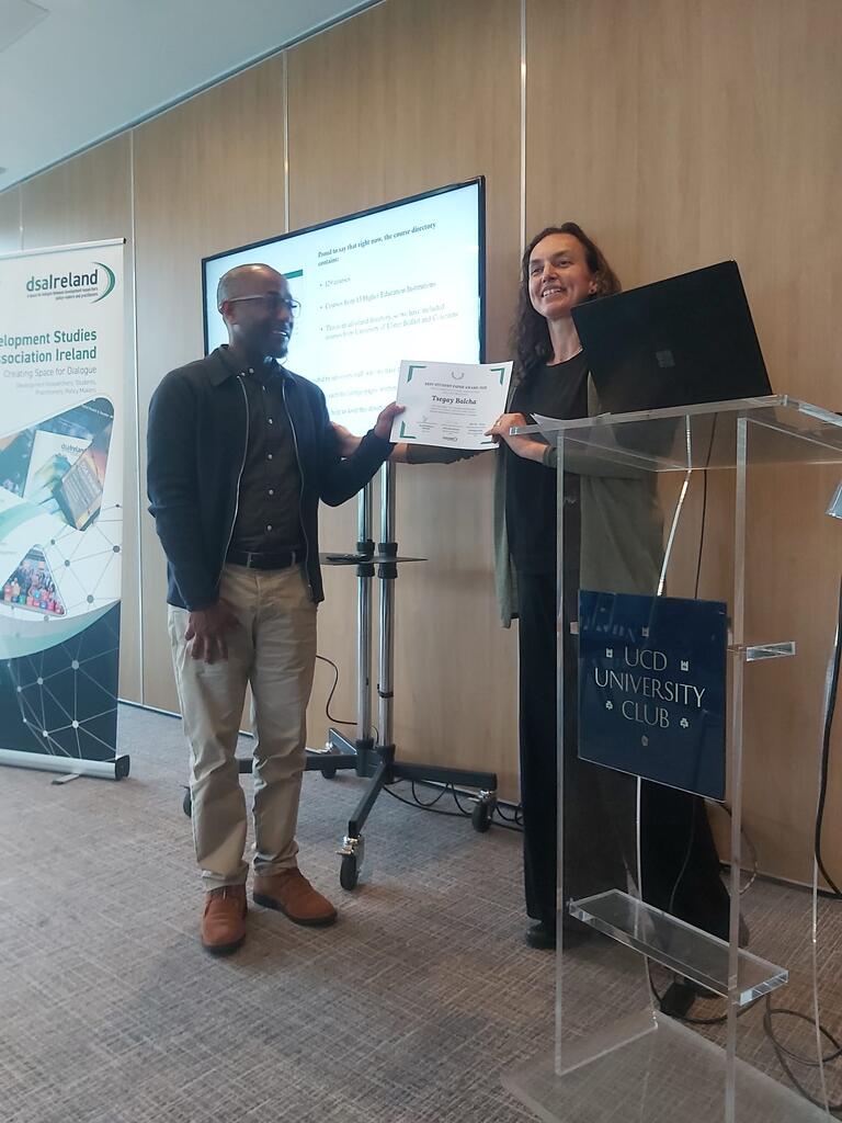 Tsegay Balcha is presented his award for Best Student Paper 2023 by DSAI Chair, Pieternella Pieterse